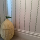 Skirting World Period MDF Skirting Board, close-up of light-colored MDF skirting with wavy pattern on a wall in a room.