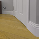 Skirting World Regency MDF Skirting Board, white skirting board fitted along the base of the wall next to a wooden floor.