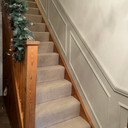 Skirting World Mini Ogee 1 MDF Dado Rail, wooden staircase with beige carpet and decorative molding on the wall.