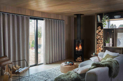 Layering textures through curtains, paint and woodwork