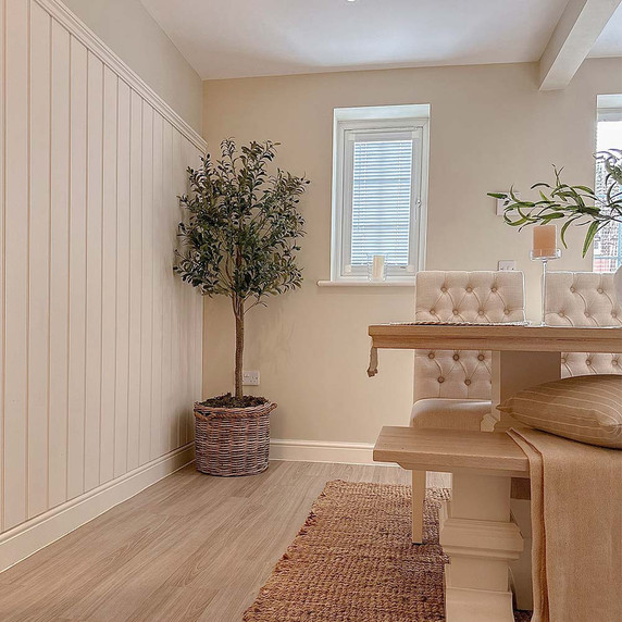 Skirting World Greenwich Tongue & Groove MDF Wall Panelling Kit, interior residential room featuring wall panels, a potted plant, a window with blinds, and dining furniture.