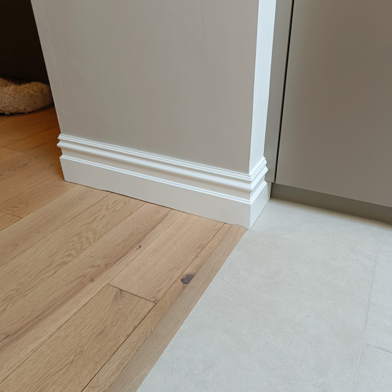 Skirting World Period MDF Skirting Board, white decorative molding along the bottom edge of a wall near the floor.