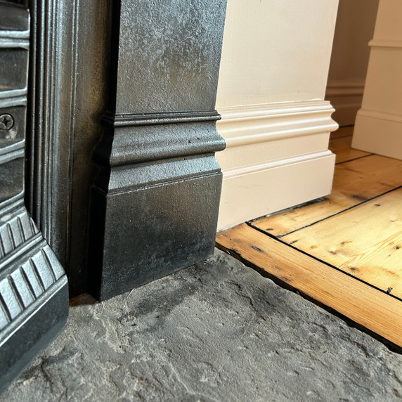 Skirting World Period MDF Skirting Board, close-up of black and white MDF skirting boards installed at the bottom of walls next to a wooden floor.