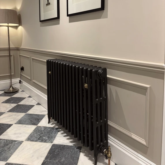 Skirting World Edwardian MDF Architrave, elegant white decorative molding on a wall in a stylish interior setting.