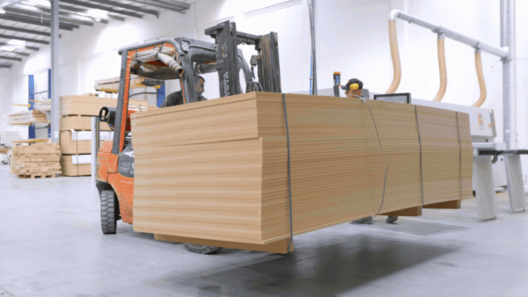 MDF sheets in manufacturing facility showing smooth, uniform surface