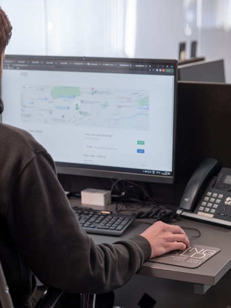 Employee operating desktop system viewing logistics information