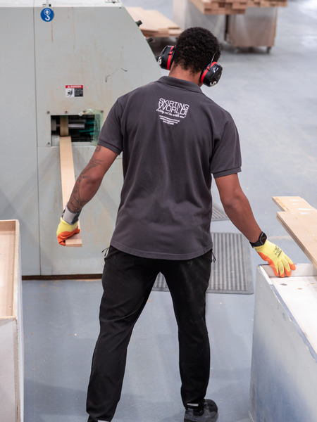 Professional cutting MDF panel with circular saw, demonstrating proper technique and dust extraction
