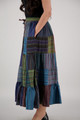 side view of blue, green and purple patchwork maxi skirt with drawstring waist and side pockets
