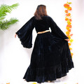 back view of a velvet tiered maxi skirt and top, with flowing layered design

