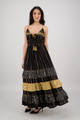 caucasian brunette female wears long black tiered maxi dress with spagetti straps and gold accents