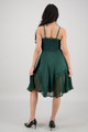 back view of a hunter green spaghetti strap knee length dress with smocked bodice and pointy handkerchief hem