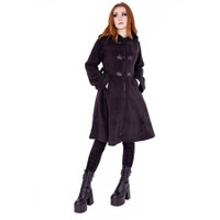 image of a female model wearing a  longsleeve black trench style coat with bat apliques on a white background