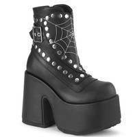 photo of a black midcalf platform boot with buckle closure, studded trim and spiderweb front panel on a white background