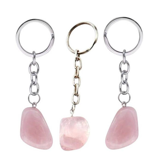 image shows 3 silver tone keyrings each with a tumbled piece of rose quartz