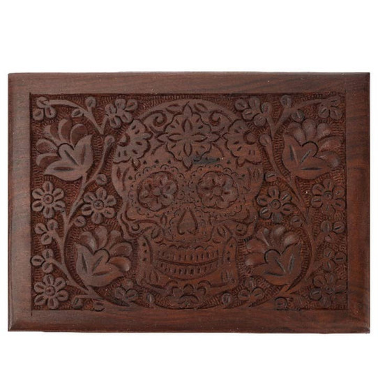 Carved brown trinket box with floral motif and center sugar skull