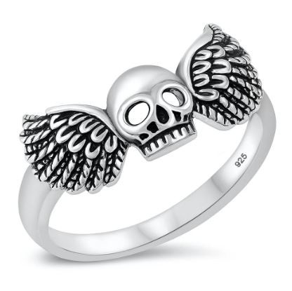 sterling silver winged skull ring on white background