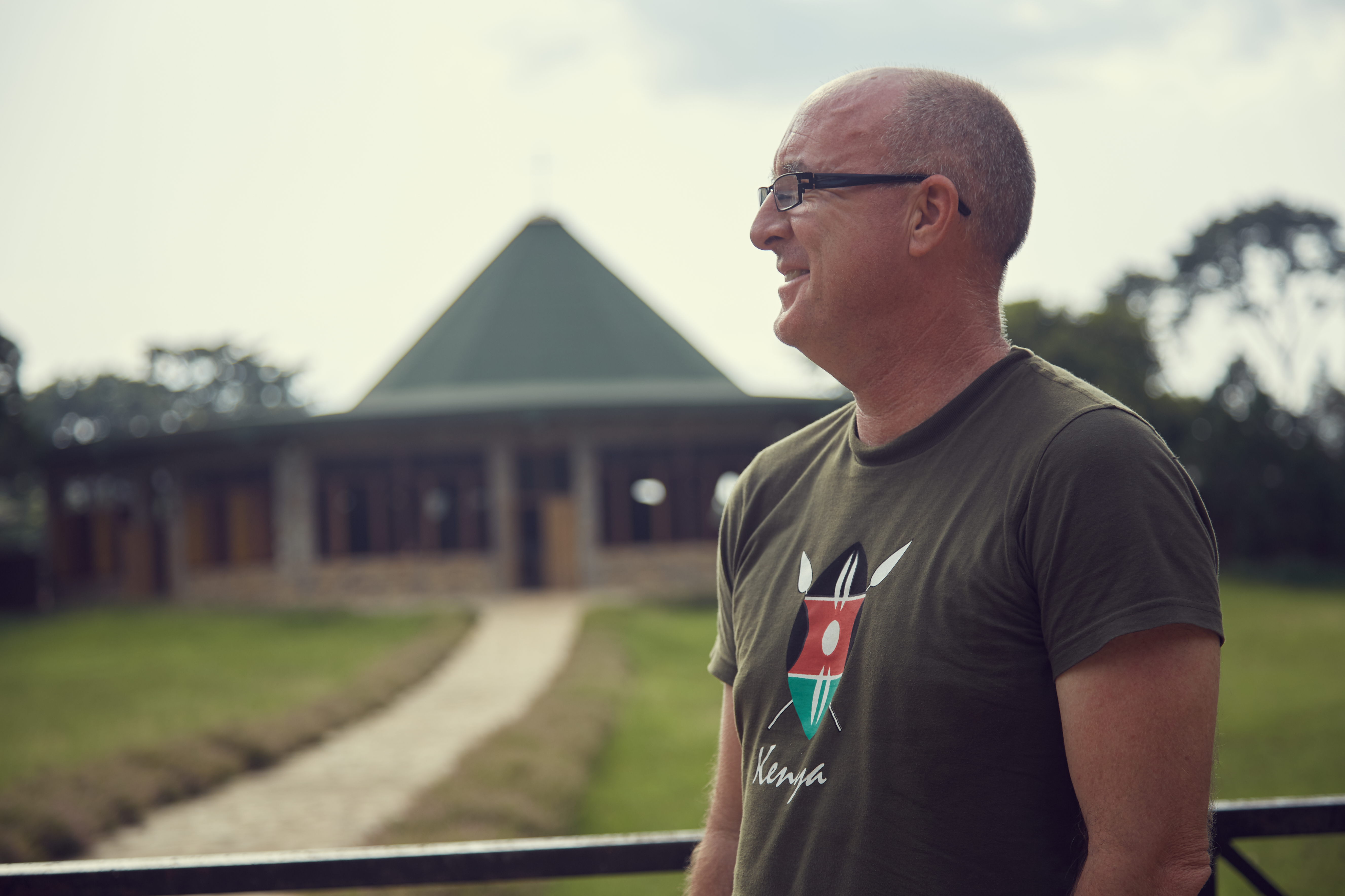 Cillian Walsh in Kenya t-shirt smiling.