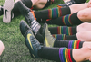 pride socks black rainbow striped compression socks are used to play by pro soccer players