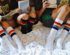 a family that wears the same pride socks, stays together
