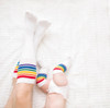 So much love is shared when mom and baby wake up together and match in their rainbow striped tube socks
