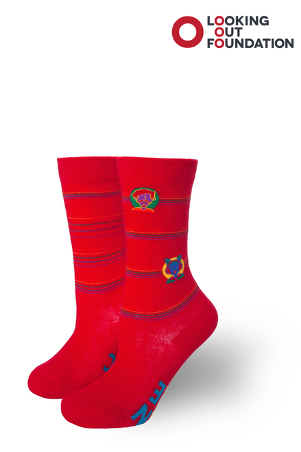 pride socks and brandi carlile collab and design a kids socks for the looking out foundation in austin texas
