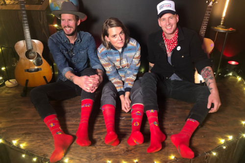 brandi-carlile-and-tim-and-phil-seattle-pride-socks.png