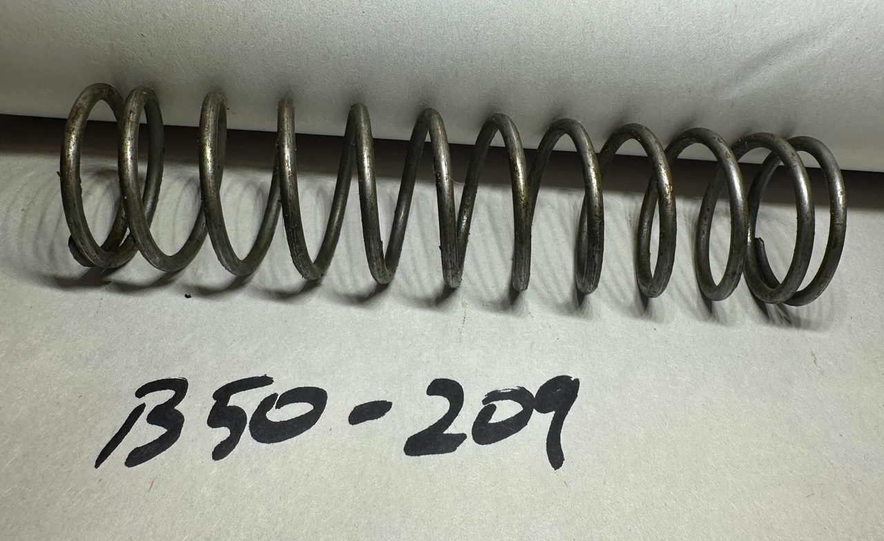 2:  BARREL BUFFER SPRING, HELICAL, COMPRESSION: 6009832