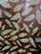 Decorative leather sheet with mint green tribal feather design on rich brown background – perfect for handmade wallets, journals, and custom leather projects. Decorative leather sheet with mint green tribal feather design on rich brown background – perfect for handmade wallets, journals, and custom leather projects.