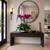 Luxury cascading white Phalaenopsis orchid arrangement in a modern silver round base for elegant home décor