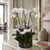Luxury Swan and medium orchid arrangement with greenery and air plants in a clear glass vase