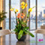 Live Phalaenopsis orchid arrangement in decorative vase