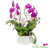 Purple Phalaenopsis orchids with metallic gold ginkgo leaves and frosted pinecones