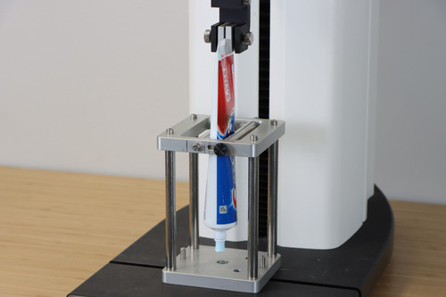 Tube Extrusion Fixture measures continuous extrusion force of tube or sachet samples. Top vice grip included.