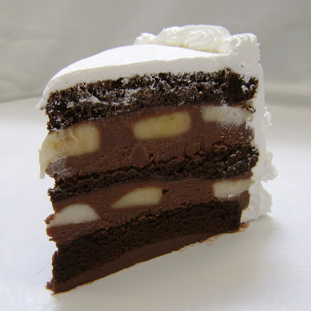 BANANA CHOCOLATE: moist layers of Chocolate cake layers filled with creamy Chocolate custard layered with fresh sliced bananas. (Please note: bananas may turn dark as they naturally ripen.) Add $3.