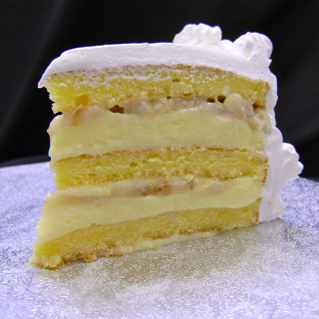 BANANA CREAM: moist layers of Yellow cake filled with creamy French Vanilla custard layered with fresh sliced bananas. (Please note: bananas may turn dark as they naturally ripen.) Add $3.