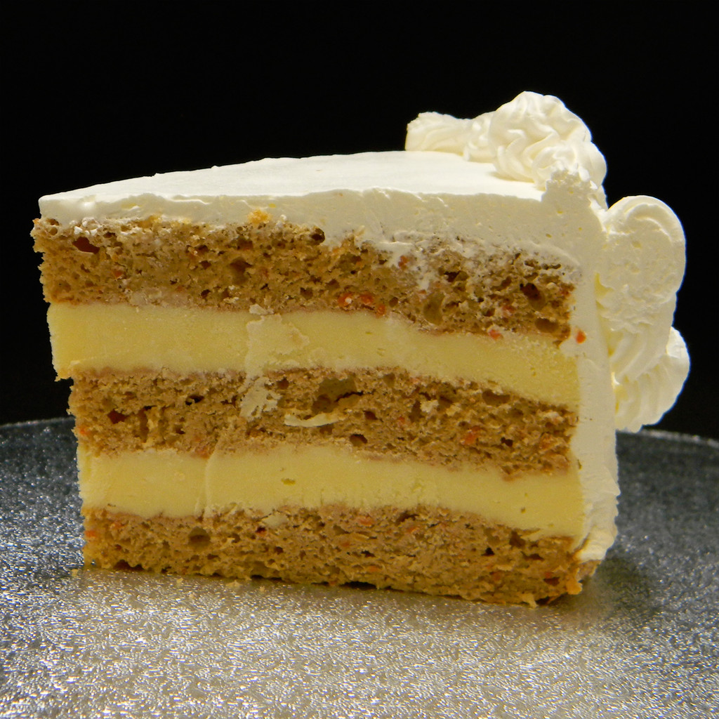 CARROT: our moistest cake and not your traditional carrot cake. More like a spice cake baked with carrot flakes and the necessary spices, filled with French Vanilla custard. No nuts or raisins.