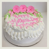 Double ruffle border with pink frosting roses.