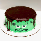 Dark chocolate ganache and green tinted whipped cream frosting.