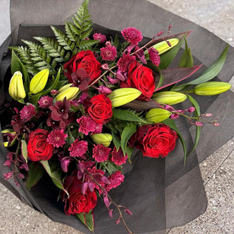 Deep reds and purples in this lush bouquet. 