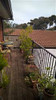 900mm high black Aluminium garden fence panels on a low deck (under 1m drop).