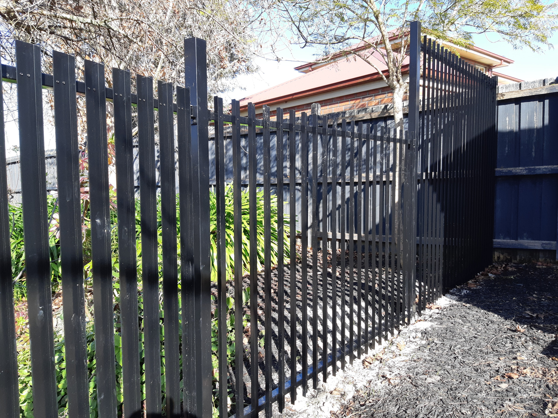 Slat Fence Pool Safe Fence Panel in Black FenceGuru