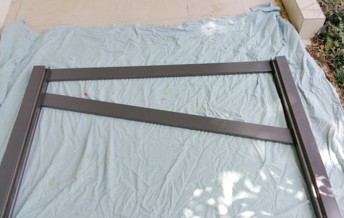 Slat Gate Side Frame Kit Assembly STEP 1 - Attach the first slat level with the top of the gate frames with 1 screw only on each side. Make sure the slat is hard against the gate frame. Slat Gate Side Frame Kit Assembly STEP 1 - Attach the first slat level with the top of the gate frames with 1 screw only on each side. Make sure the slat is hard against the gate frame.