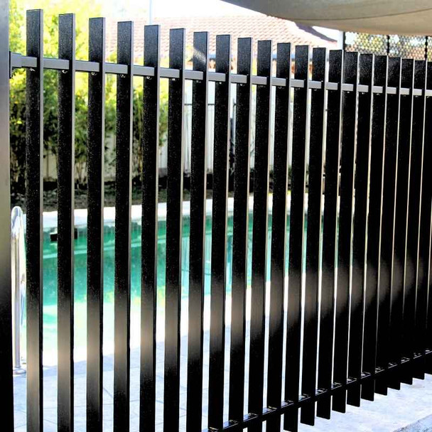 Pool Compliant Slat-Fence (with 50x10mm blades) is a Verti-Slat Fencing System that's available on the east coast in 1.2m high, in Satin Black, Surfmist (off-white) and Monument (very dark grey).