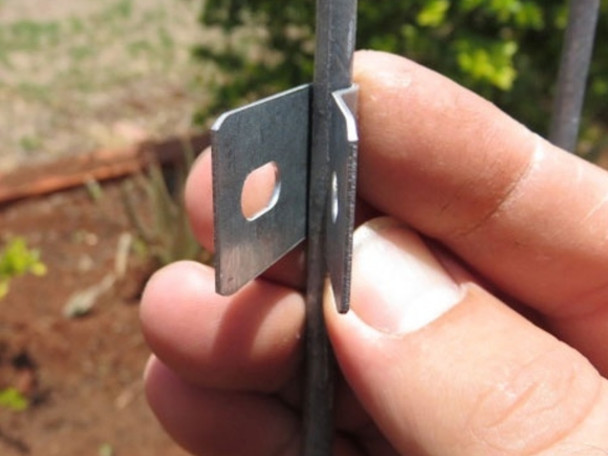 Photo of man holding a fast & easy VeriSmart Galvanised Fencing U Clip