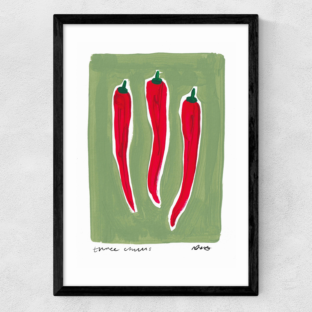 Three chillis art print by natalie cass in black frame