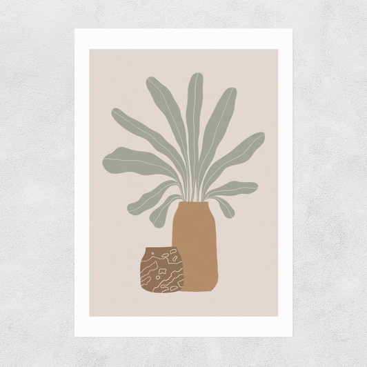 Two Brown Vases And Green Plant