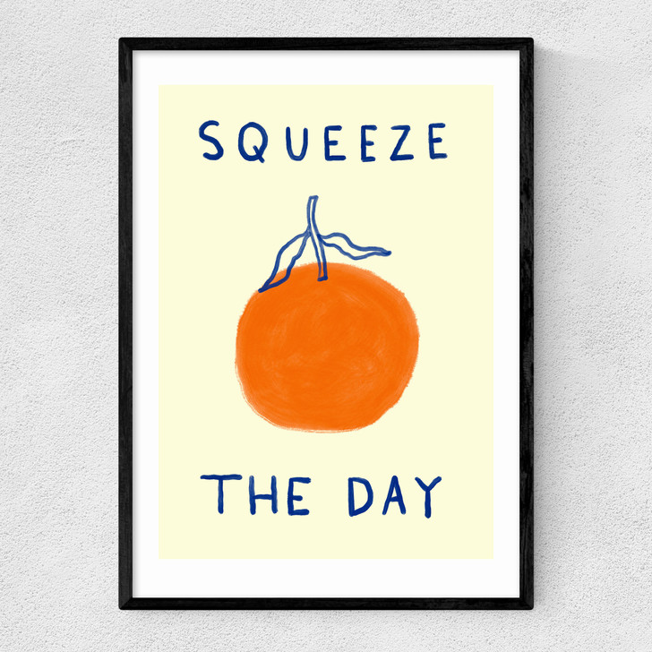 squeeze the day orange art print by she snacks and paints in black frame