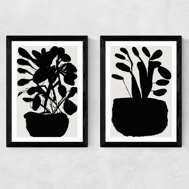 potted plant silhouette art print set by cartissi in black frame