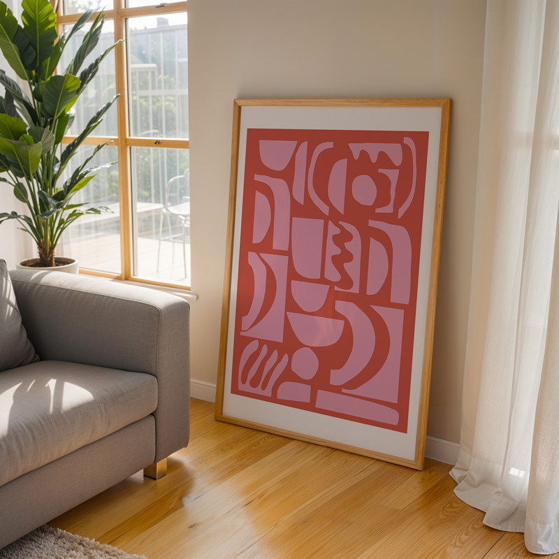 abstract shapes 21 in pink and red art print by apricot + birch in oak frame