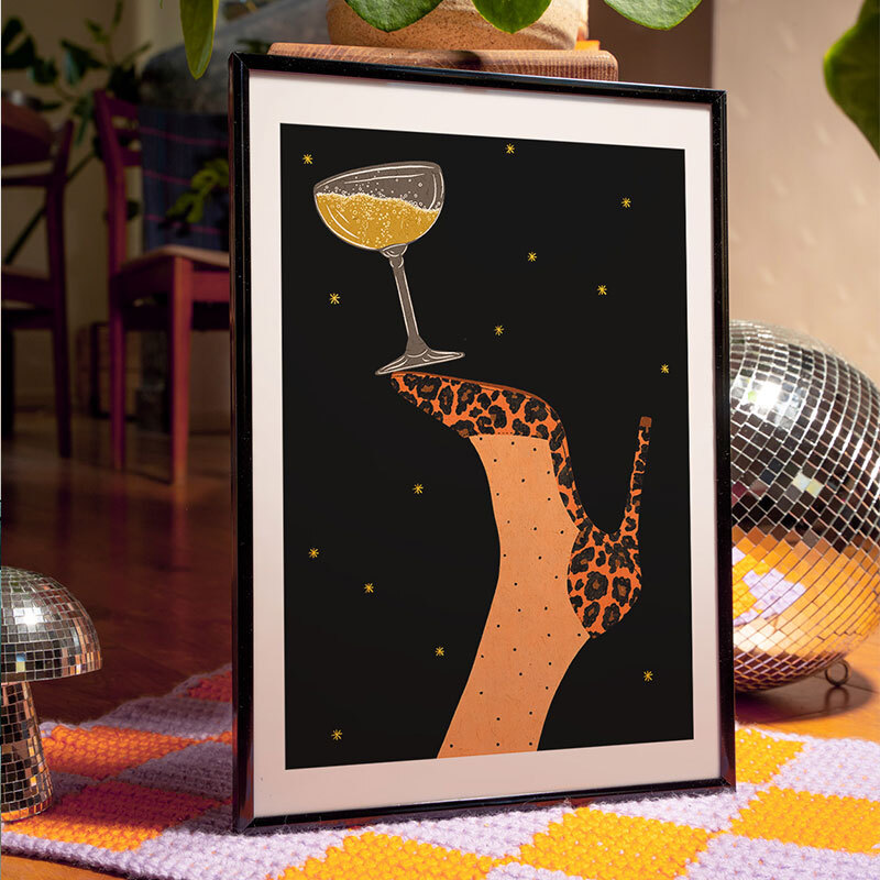champagne and dancing art print by lemon fee in black frame